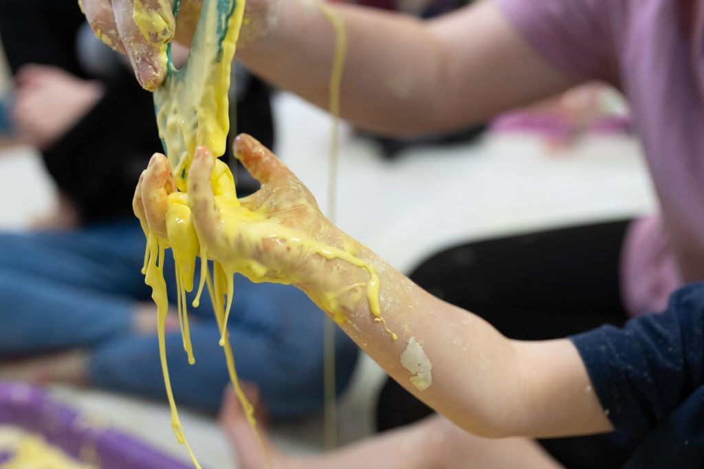 babies-hands-covered-in-paint