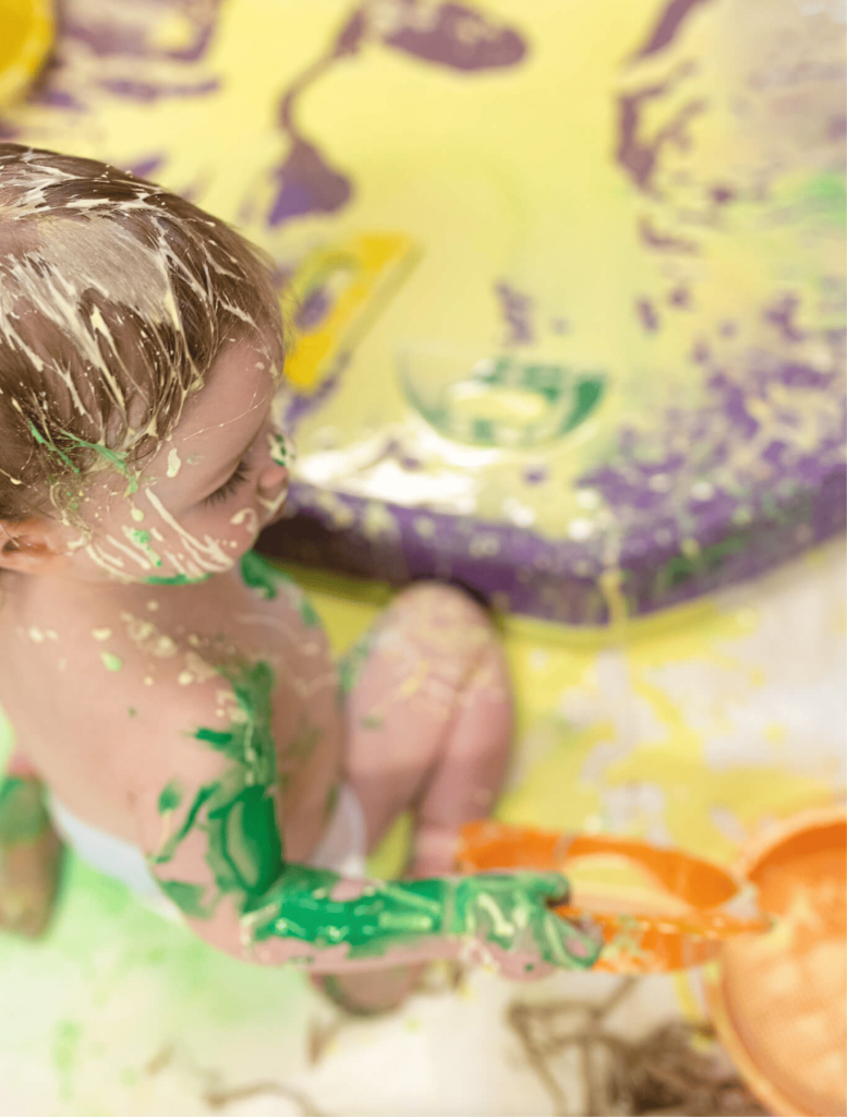 baby-playing-with-paints-during-class